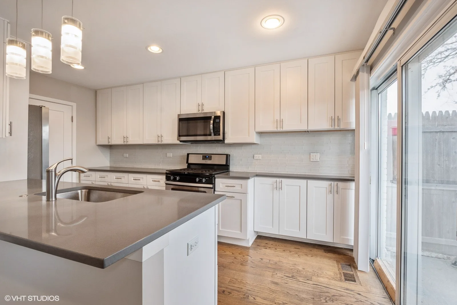 Kitchen with quartz countertops and stainless steel appliances